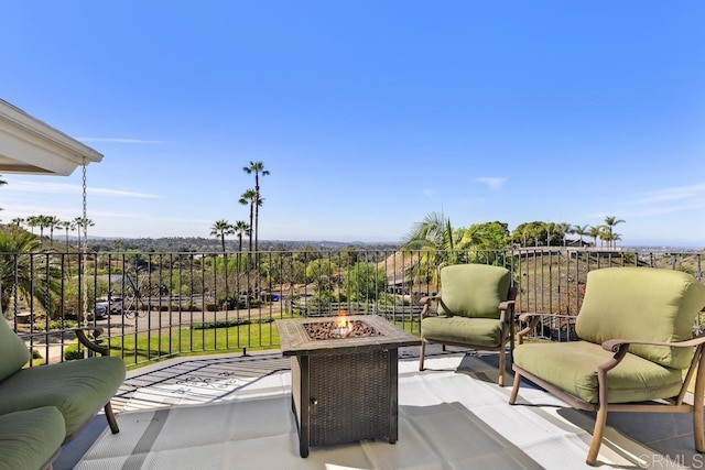 view of patio / terrace with a fire pit