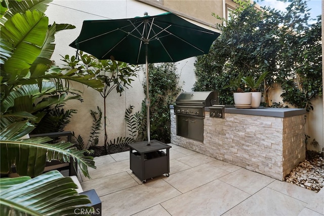 view of patio with grilling area and exterior kitchen