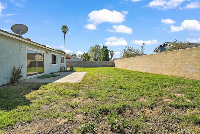 view of yard featuring a fenced backyard and a patio