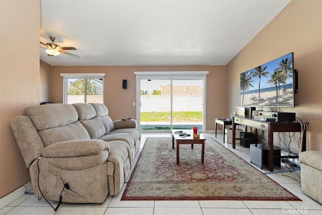 living room featuring vaulted ceiling and light tile patterned floors