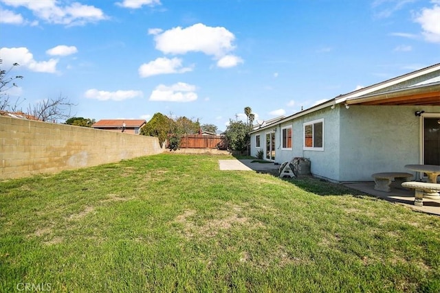 view of yard featuring a fenced backyard and a patio