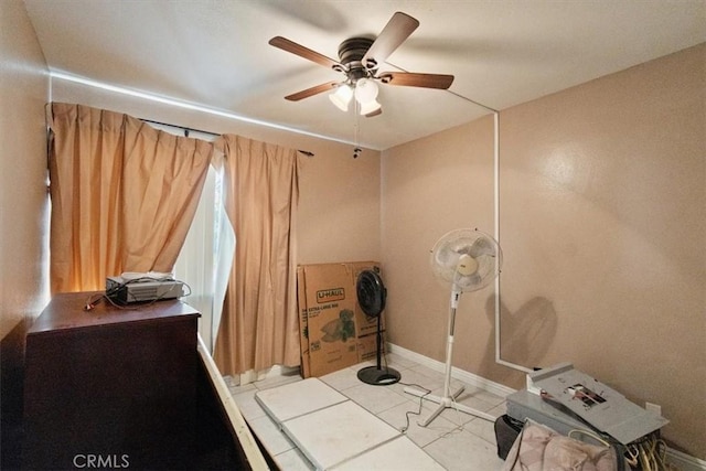 misc room featuring ceiling fan and light tile patterned floors