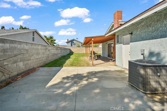 view of patio / terrace featuring a fenced backyard and central AC unit