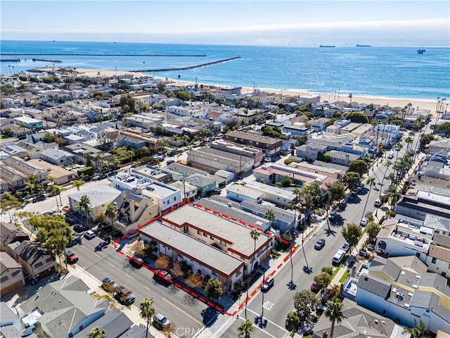 drone / aerial view with a residential view and a water view