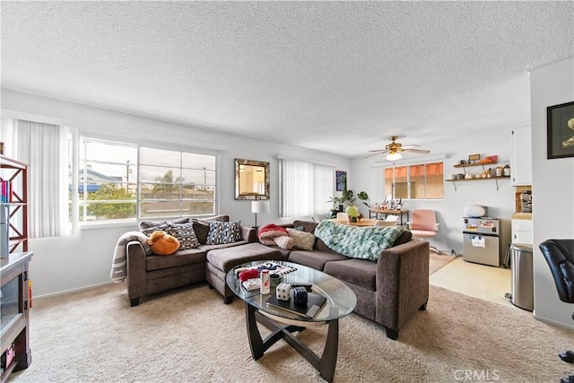 1102 Central Ave, Seal Beach, CA 90740 - living area with light colored carpet, a textured ceiling, and ceiling fan