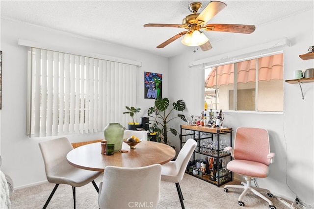 1102 Central Ave, Seal Beach, CA 90740 - dining space with carpet, a textured ceiling, and a ceiling fan