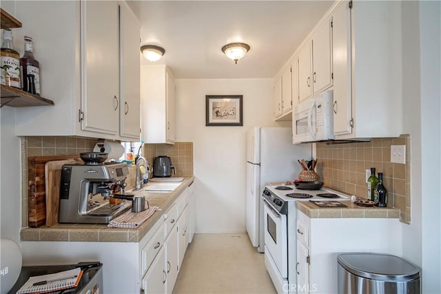 1102 Central Ave, Seal Beach, CA 90740 - kitchen with white cabinets, tasteful backsplash, a sink, and white appliances