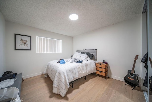 1102 Central Ave, Seal Beach, CA 90740 - bedroom featuring light wood finished floors, baseboards, and a textured ceiling