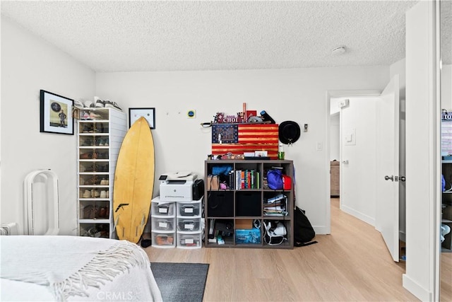 1102 Central Ave, Seal Beach, CA 90740 - bedroom with wood finished floors and a textured ceiling