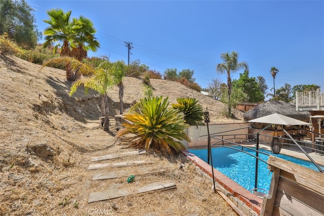 view of pool featuring a fenced in pool and fence