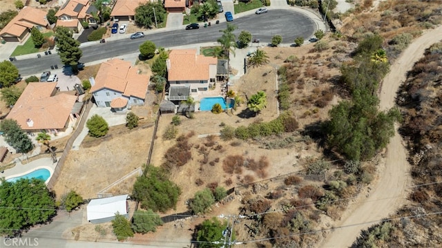 birds eye view of property with a residential view