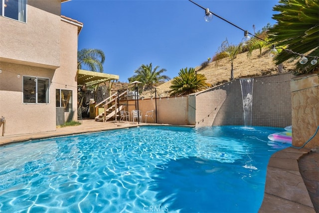 view of pool featuring a fenced backyard, a fenced in pool, and a pergola