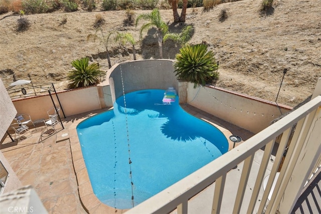 view of pool with fence and a fenced in pool