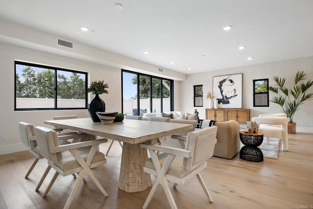 dining area with visible vents, baseboards, light wood-style flooring, and recessed lighting