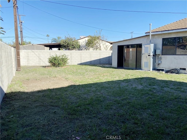 view of yard with a fenced backyard