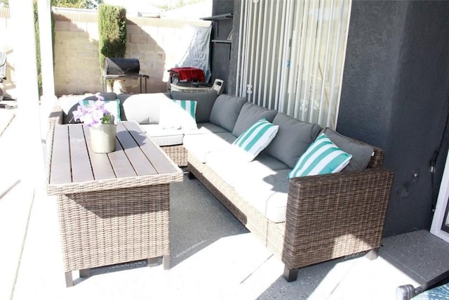 balcony featuring a patio and an outdoor living space