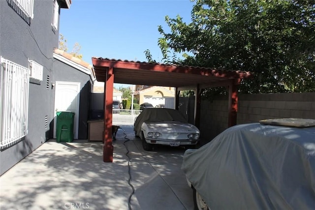 view of parking with fence