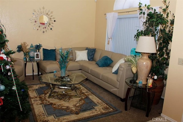 living area featuring baseboards