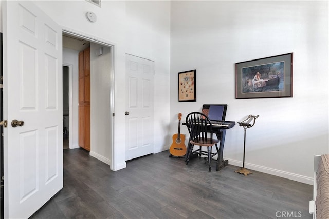 home office featuring dark wood finished floors and baseboards