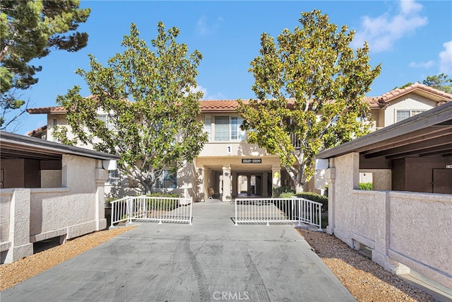 exterior space featuring a gate and a gated entry