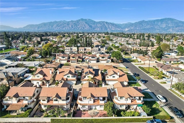 birds eye view of property with a residential view and a mountain view