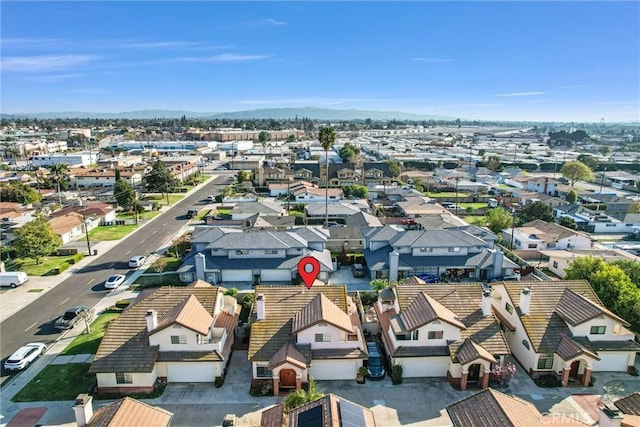 birds eye view of property with a residential view and a mountain view