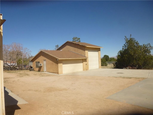 view of home's exterior featuring cooling unit and stucco siding