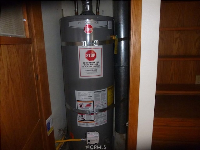 utility room featuring gas water heater