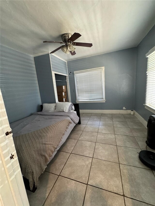 1375 E 46th St, Los Angeles, CA 90011 - tiled bedroom with baseboards and ceiling fan
