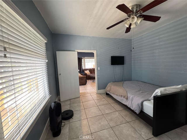 1375 E 46th St, Los Angeles, CA 90011 - tiled bedroom featuring ceiling fan