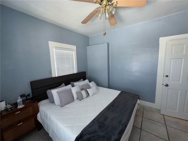 1375 E 46th St, Los Angeles, CA 90011 - bedroom featuring light tile patterned floors, baseboards, and a ceiling fan