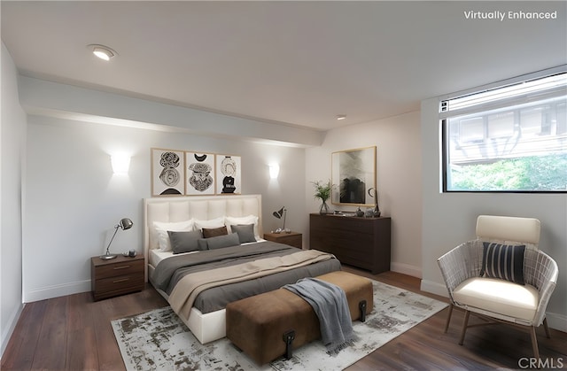 bedroom featuring baseboards and wood finished floors