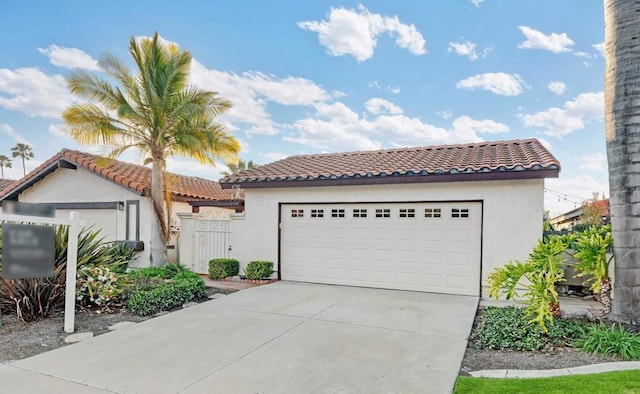 mediterranean / spanish-style house featuring a tiled roof and stucco siding