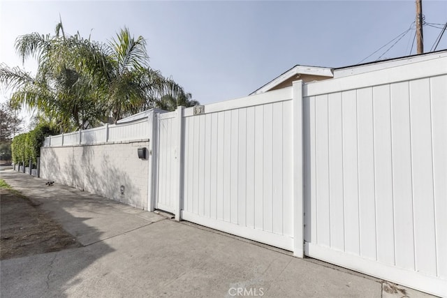 view of gate with fence