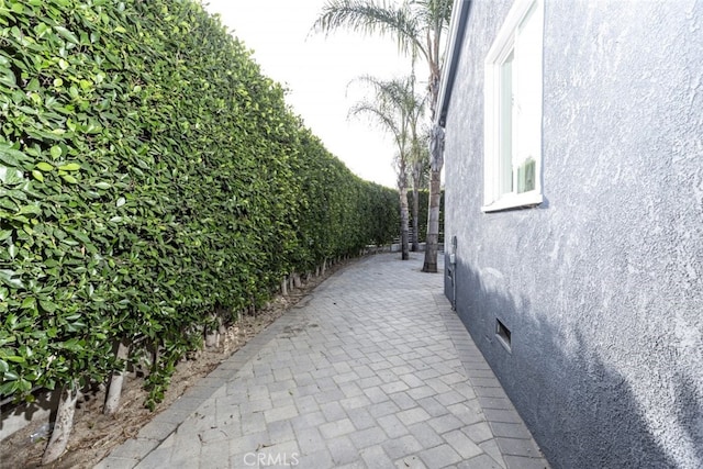 view of side of home featuring stucco siding