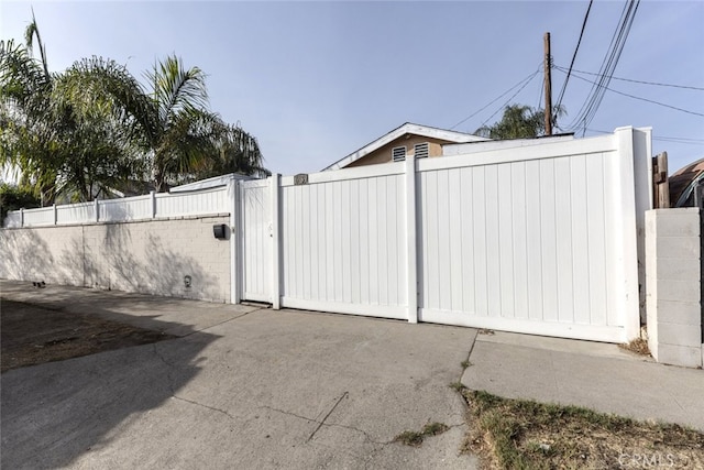 view of gate featuring fence