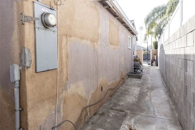 view of home's exterior featuring fence and stucco siding