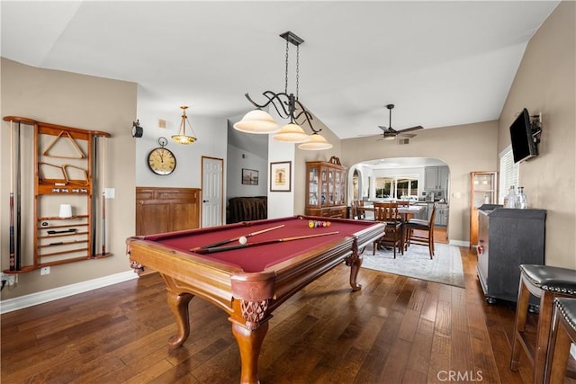 game room with arched walkways, dark wood-style flooring, lofted ceiling, pool table, and a ceiling fan