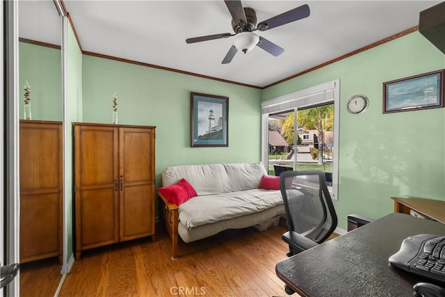 office area featuring crown molding, ceiling fan, and wood finished floors