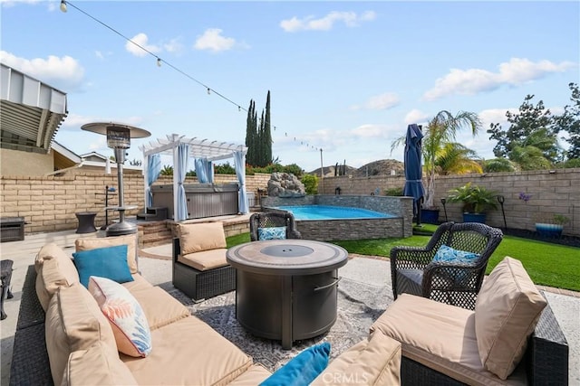 view of patio / terrace with outdoor lounge area, a fenced backyard, and a hot tub