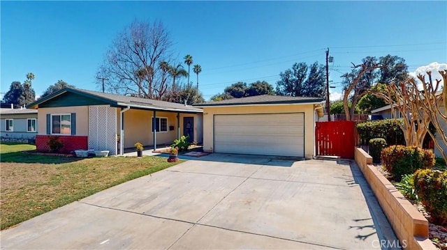 ranch-style home with brick siding, fence, a front yard, a garage, and driveway