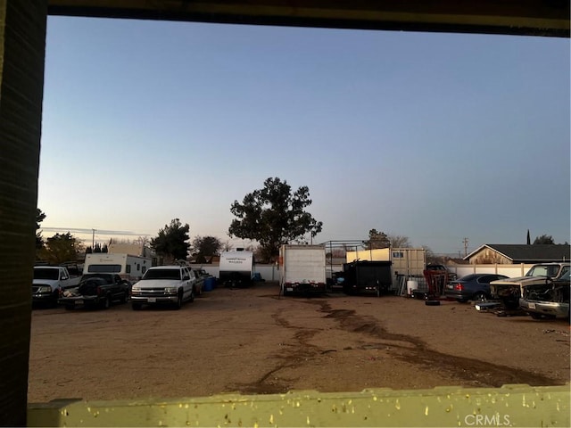 view of parking at dusk