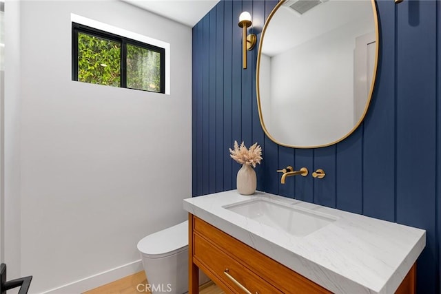 4435 Katherine Ave, Sherman Oaks, CA 91423 - bathroom featuring wood finished floors, vanity, baseboards, toilet, and visible vents
