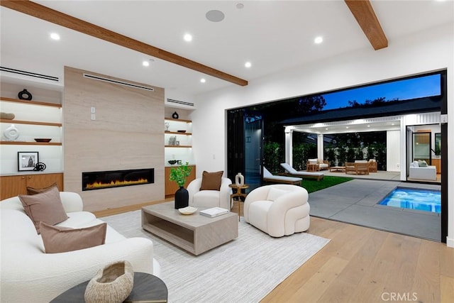 4435 Katherine Ave, Sherman Oaks, CA 91423 - living area featuring recessed lighting, wood finished floors, beamed ceiling, and a tiled fireplace