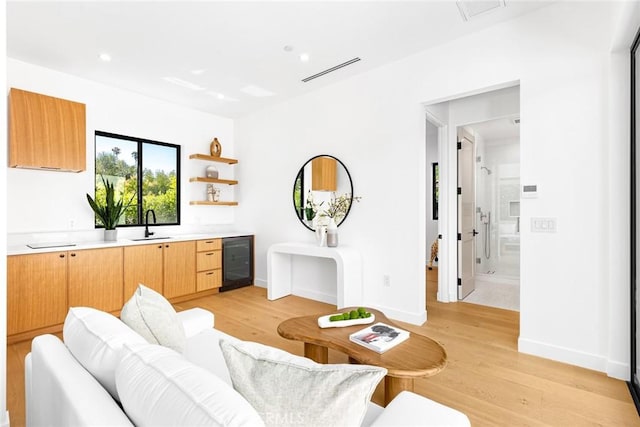 4435 Katherine Ave, Sherman Oaks, CA 91423 - living area with light wood finished floors, baseboards, visible vents, recessed lighting, and beverage cooler