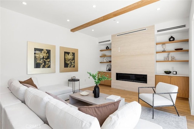 4435 Katherine Ave, Sherman Oaks, CA 91423 - living room featuring light wood finished floors, recessed lighting, beamed ceiling, a wall mounted AC, and a fireplace