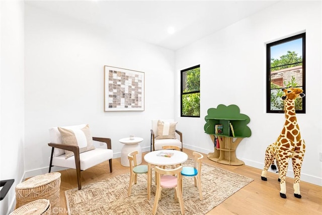 4435 Katherine Ave, Sherman Oaks, CA 91423 - living area with baseboards, a wealth of natural light, and light wood-type flooring