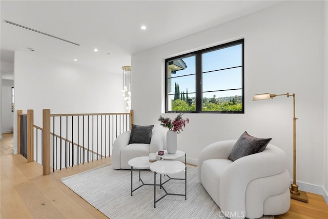 4435 Katherine Ave, Sherman Oaks, CA 91423 - living area with baseboards, an upstairs landing, light wood finished floors, and recessed lighting