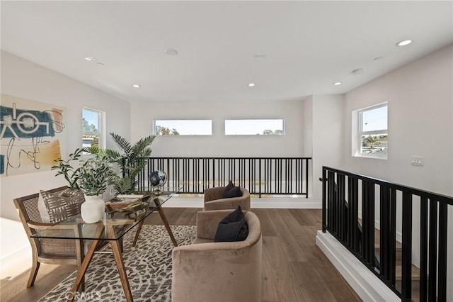 living area featuring dark wood-style floors, a wealth of natural light, and recessed lighting