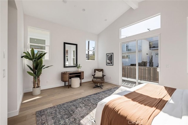 bedroom featuring access to outside, vaulted ceiling with beams, baseboards, and wood finished floors